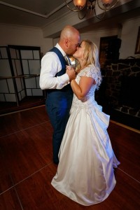 Happy daughter and son embrace at wedding